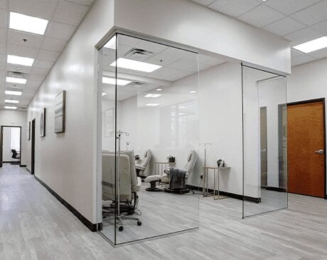 A room with glass walls and a white floor.